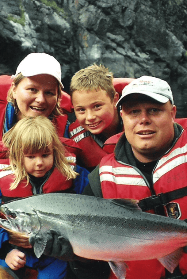 Hugh and Alicia Hague with their children and a salmon